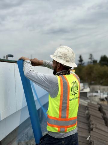 Crew installing foam parapet mesh — Duarte's Plastering project near Lakewood, CA