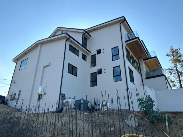 Finished three-story modern remodel, smooth coat