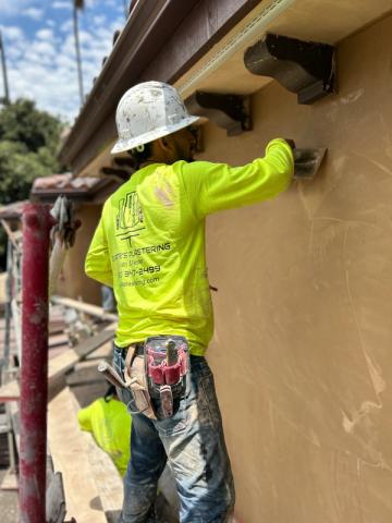 Plasterer smoothing a finish coat — Duarte's Plastering project near Irvine, CA