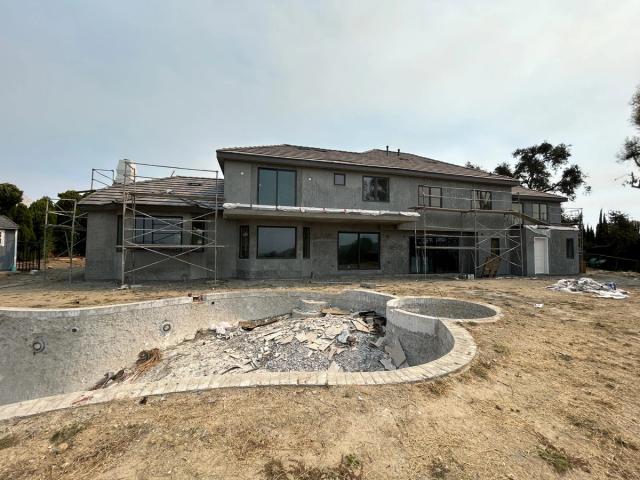 Remodel, hillside home in base coats