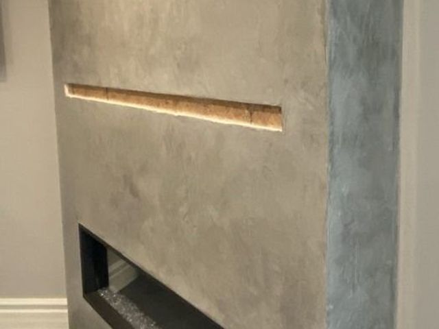 Venetian plaster media wall with linear fireplace