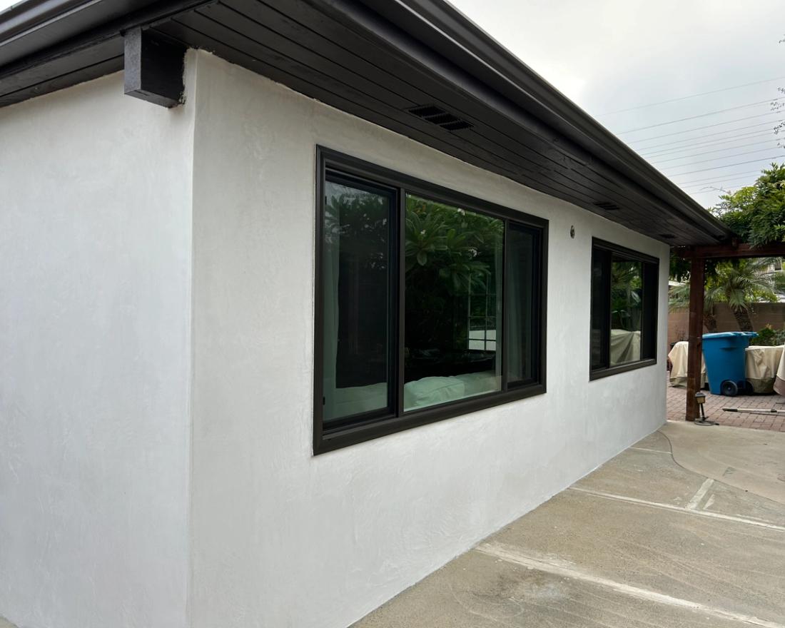 Crisp smooth finish with dark trim — Duarte's Plastering project near Garden Grove, CA