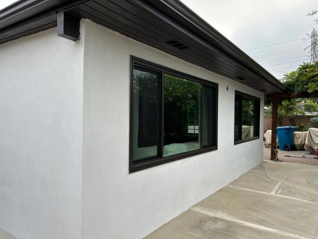Finished smooth stucco with dark trim, Huntington Beach — Duarte's Plastering project near Huntington Beach, CA