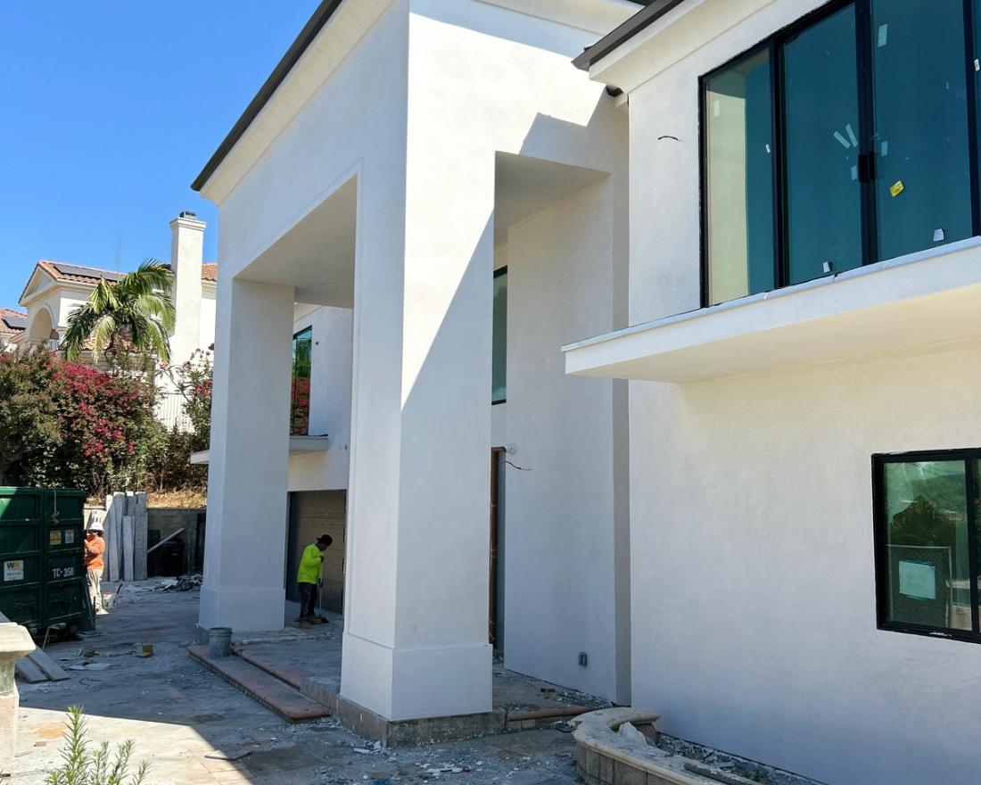 Smooth stucco at a grand two-story entry — Duarte's Plastering project near Corona, CA