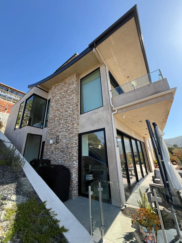 Finished smooth-troweled exterior with stacked stone
