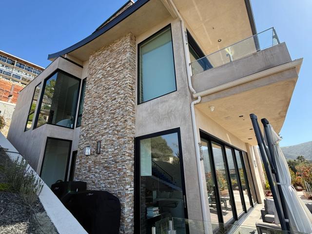 Finished smooth stucco with stacked stone — Duarte's Plastering project near Irvine, CA