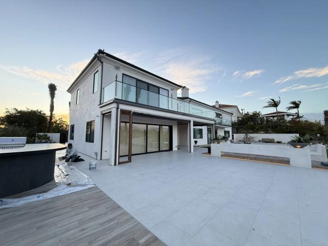 Completed hillside estate, smooth stucco and pool