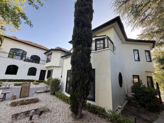 Re-stucco remodel, courtyard elevation — Duarte's Plastering project near Santa Ana, CA