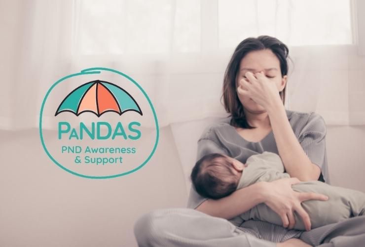 Mum with her hands on the face while her baby feeds with PaNDAS logo on the left side