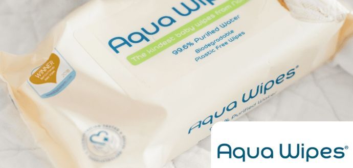 A package of Aqua Wipes with a stuffed bunny rabbit next to it