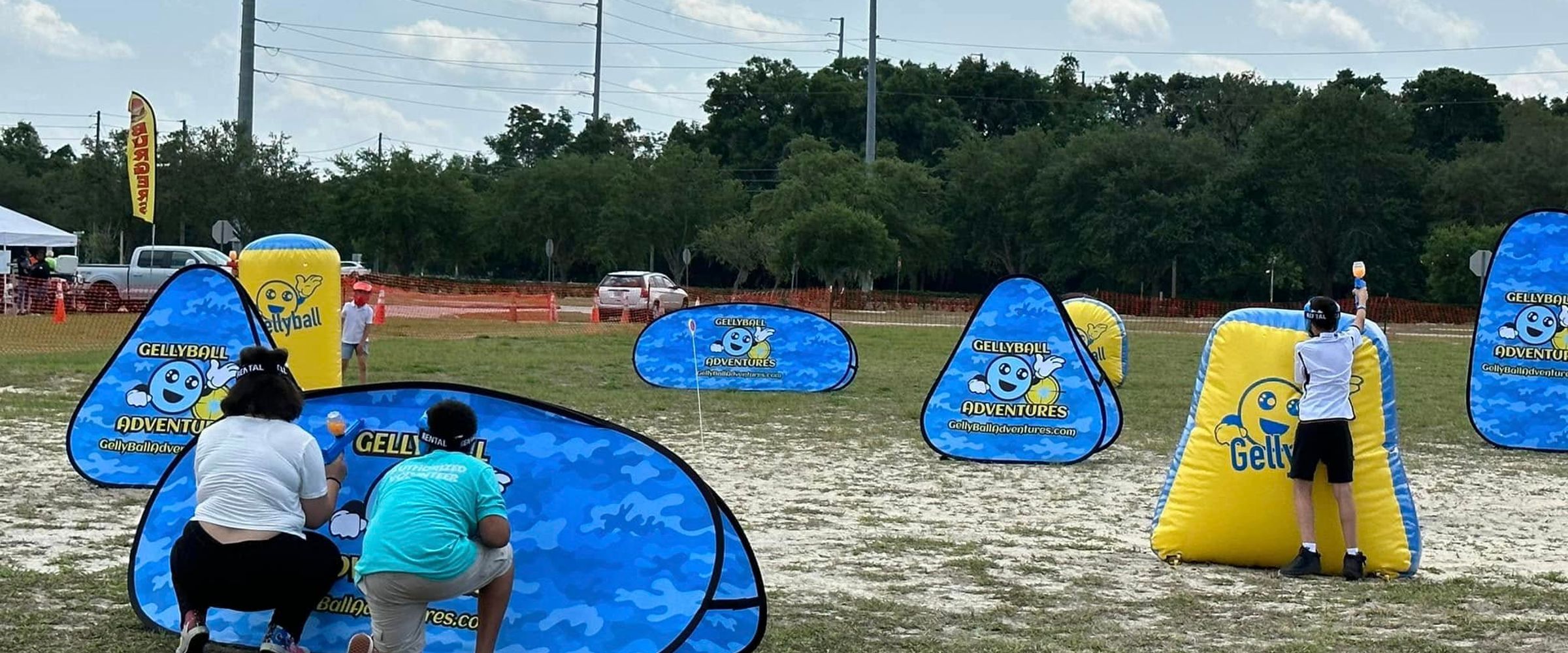 Players take cover behind pop-up bunkers on a large open field