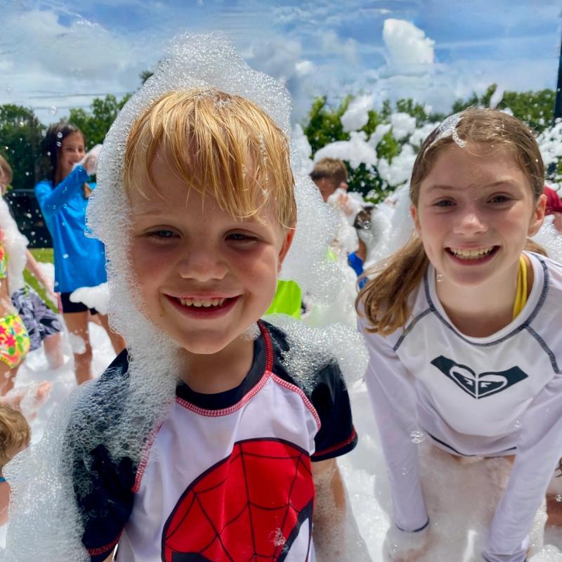 Kids smiling at a foam birthday party