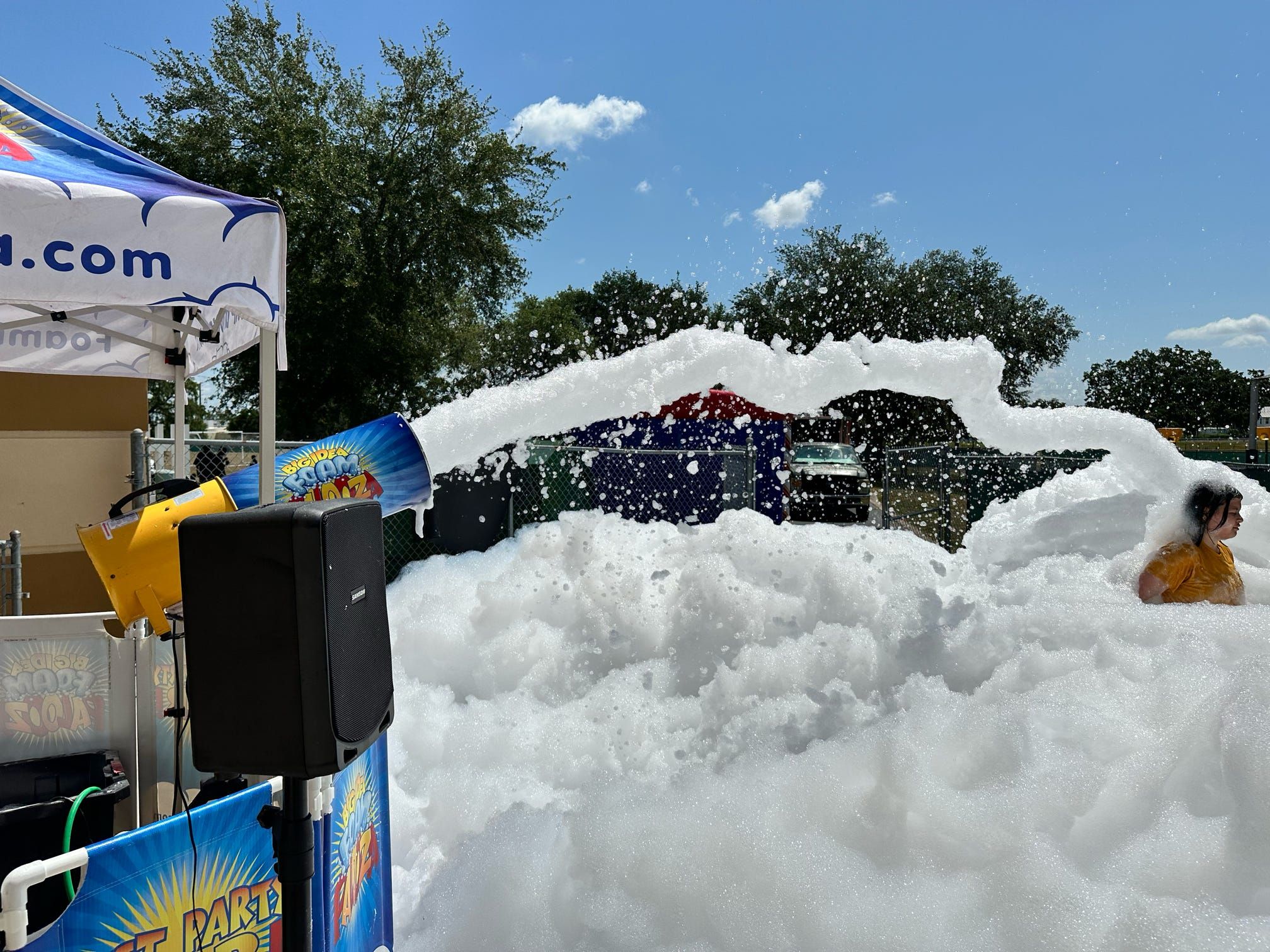 Foam cannon filling up a backyard for a birthday party