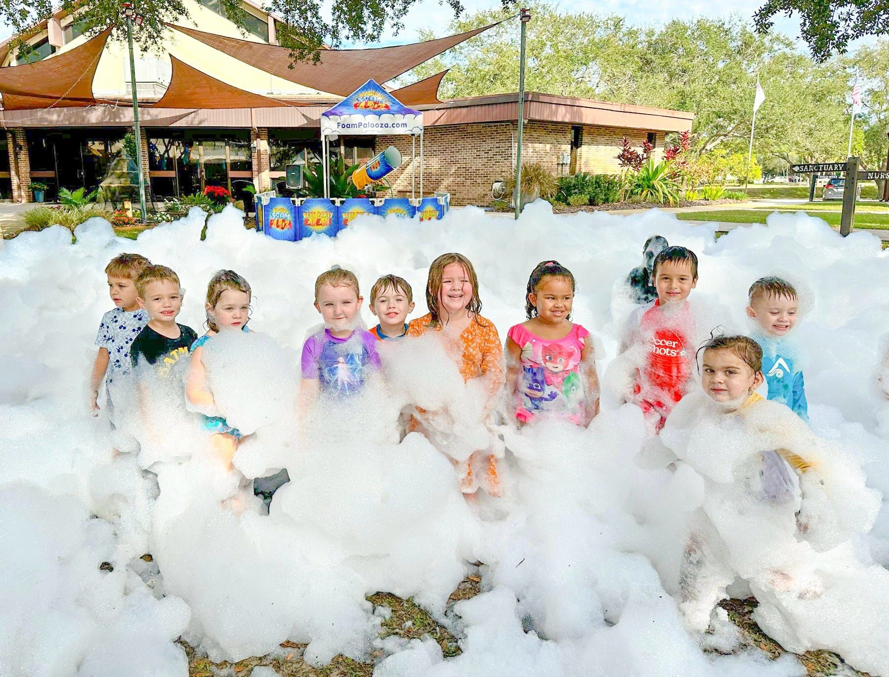 Kids at a daycare in Atlanta playing in foam