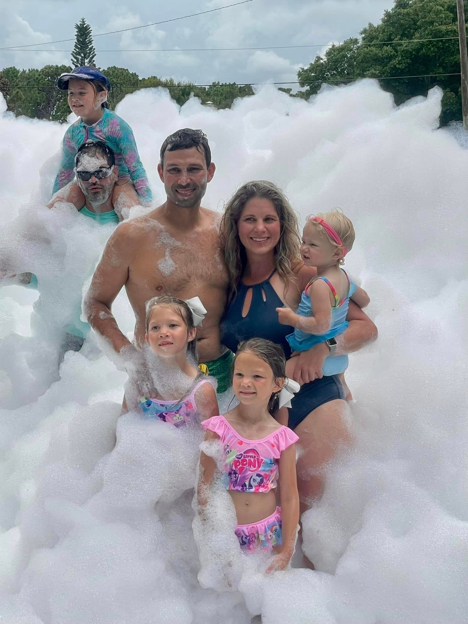 Family celebrating at a foam birthday party