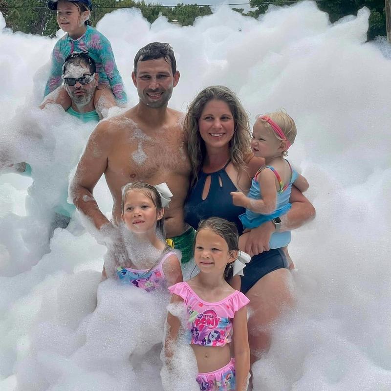 Family celebrating at a foam birthday party