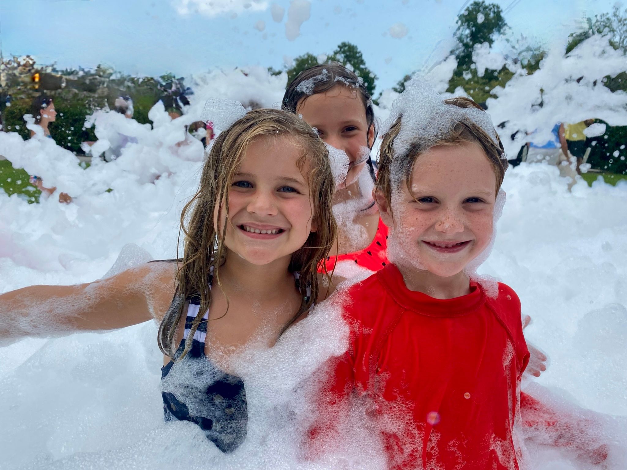 Kids playing in foam at a Foam Palooza party in Bonita Springs, FL