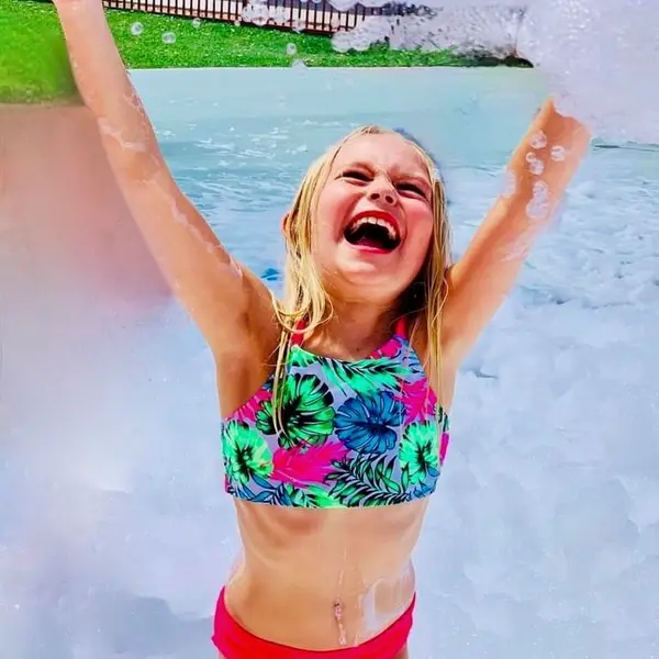 A girl screaming with joy at a foam party in Jacksonville Florida