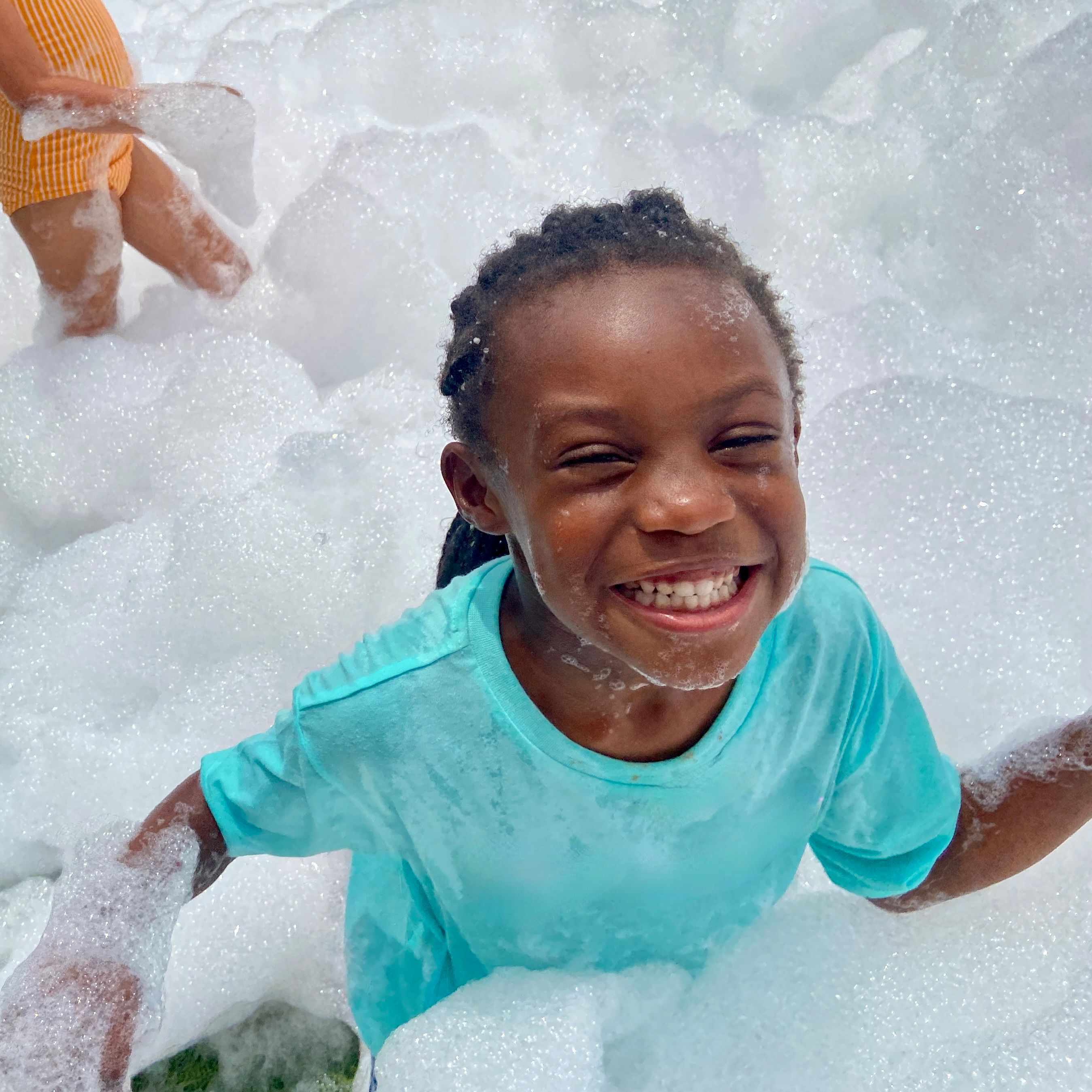 Kids playing in foam at a Foam Palooza party in Alpharetta, GA