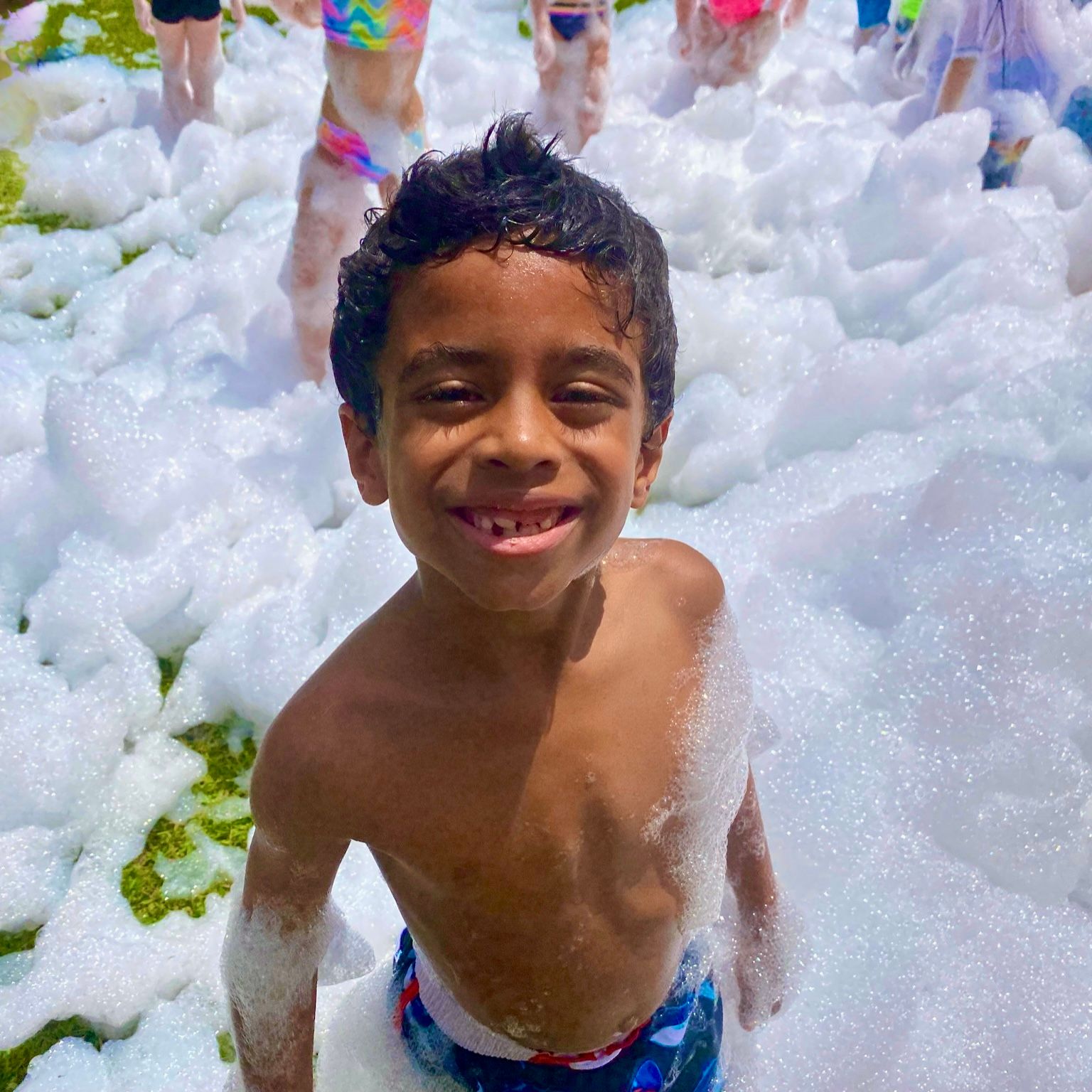 Kids playing in foam at a Foam Palooza party in New Tampa, FL