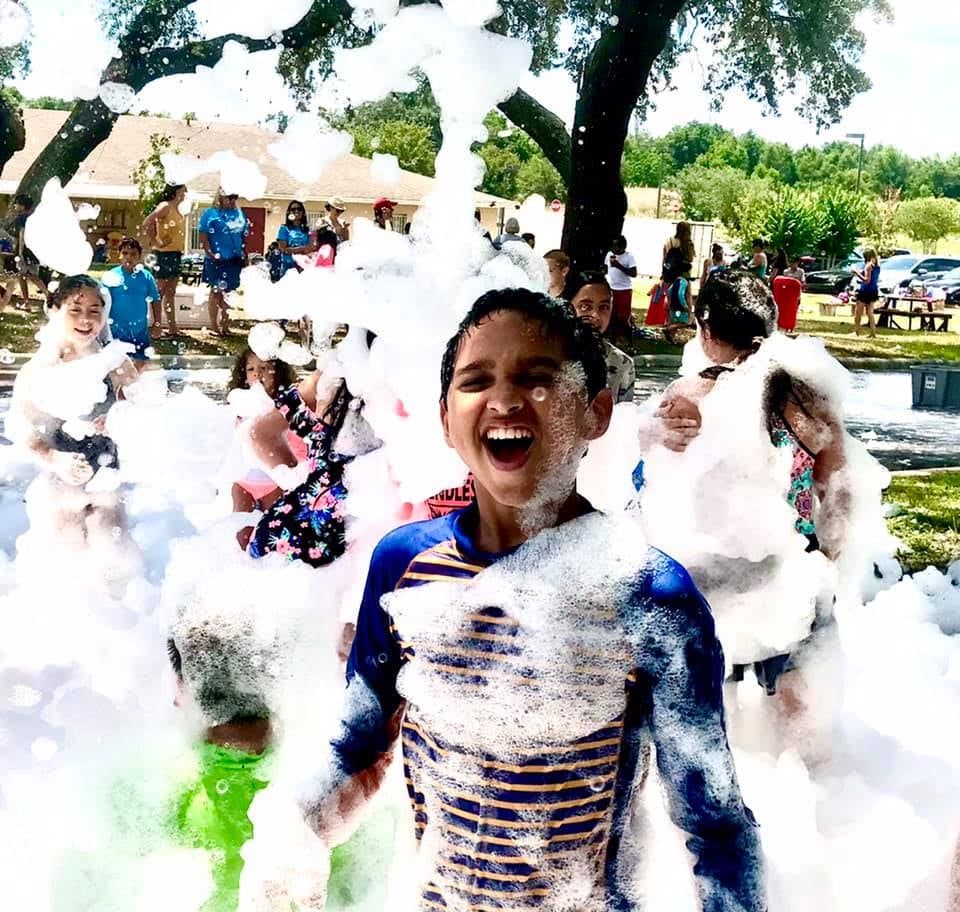 Kids playing in foam at a Foam Palooza party in Dr. Phillips, FL