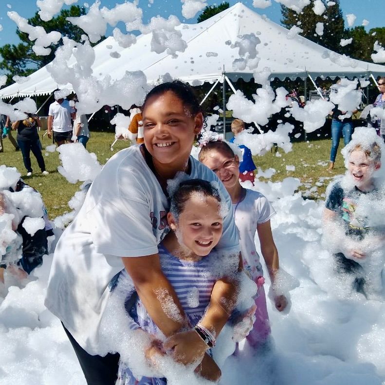 Kids playing in foam at a Foam Palooza party in Gateway, FL