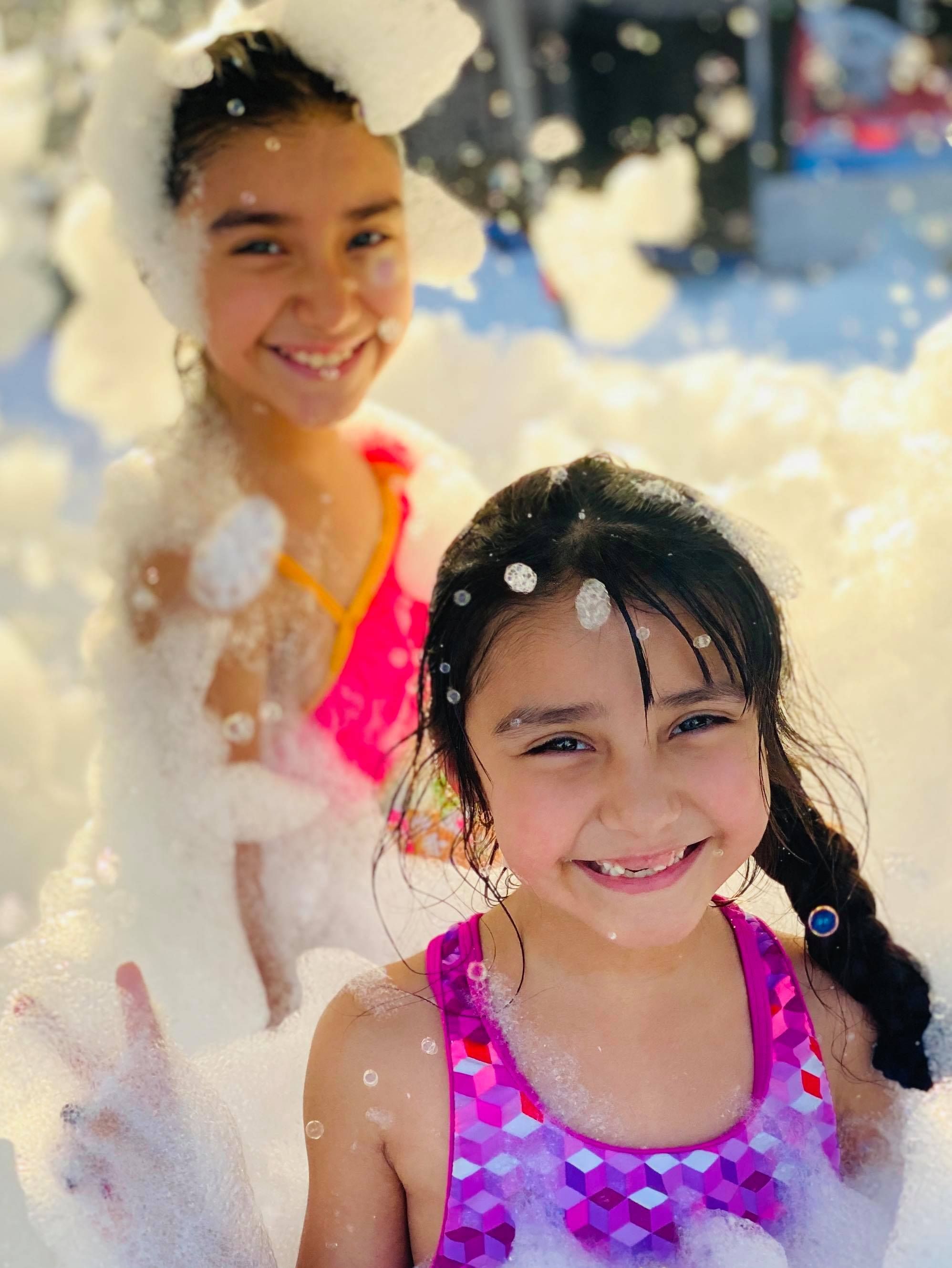 Kids playing in foam at a Foam Palooza party in Fort Myers Beach, FL