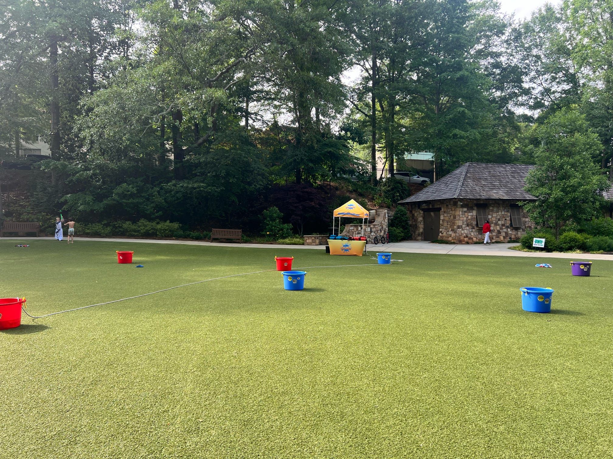 Red, blue and purple tanks set out on an empty field before the game