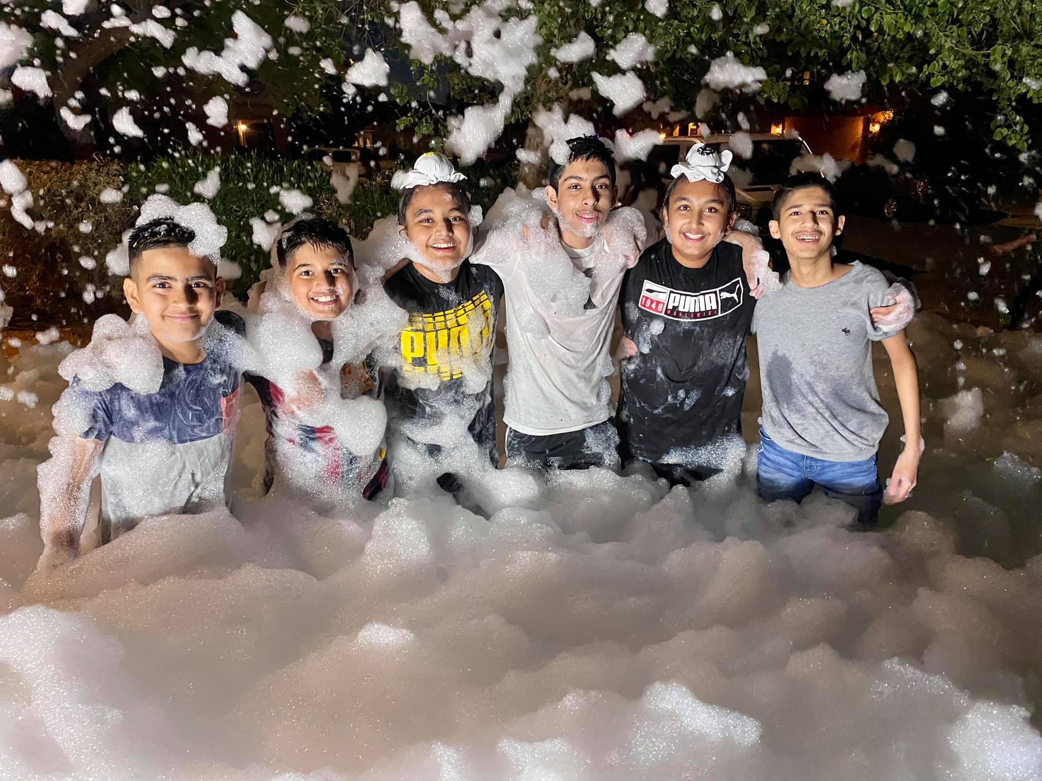 Kids playing in foam at a Foam Palooza party in Estero, FL