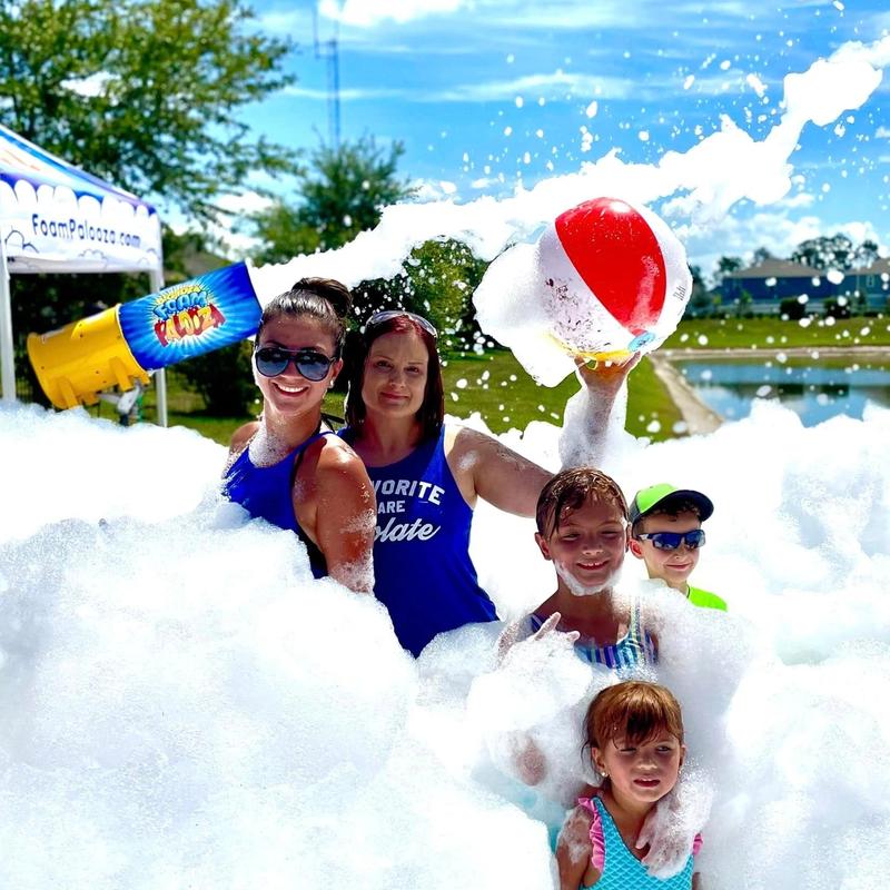Parents and kids at a foam birthday party