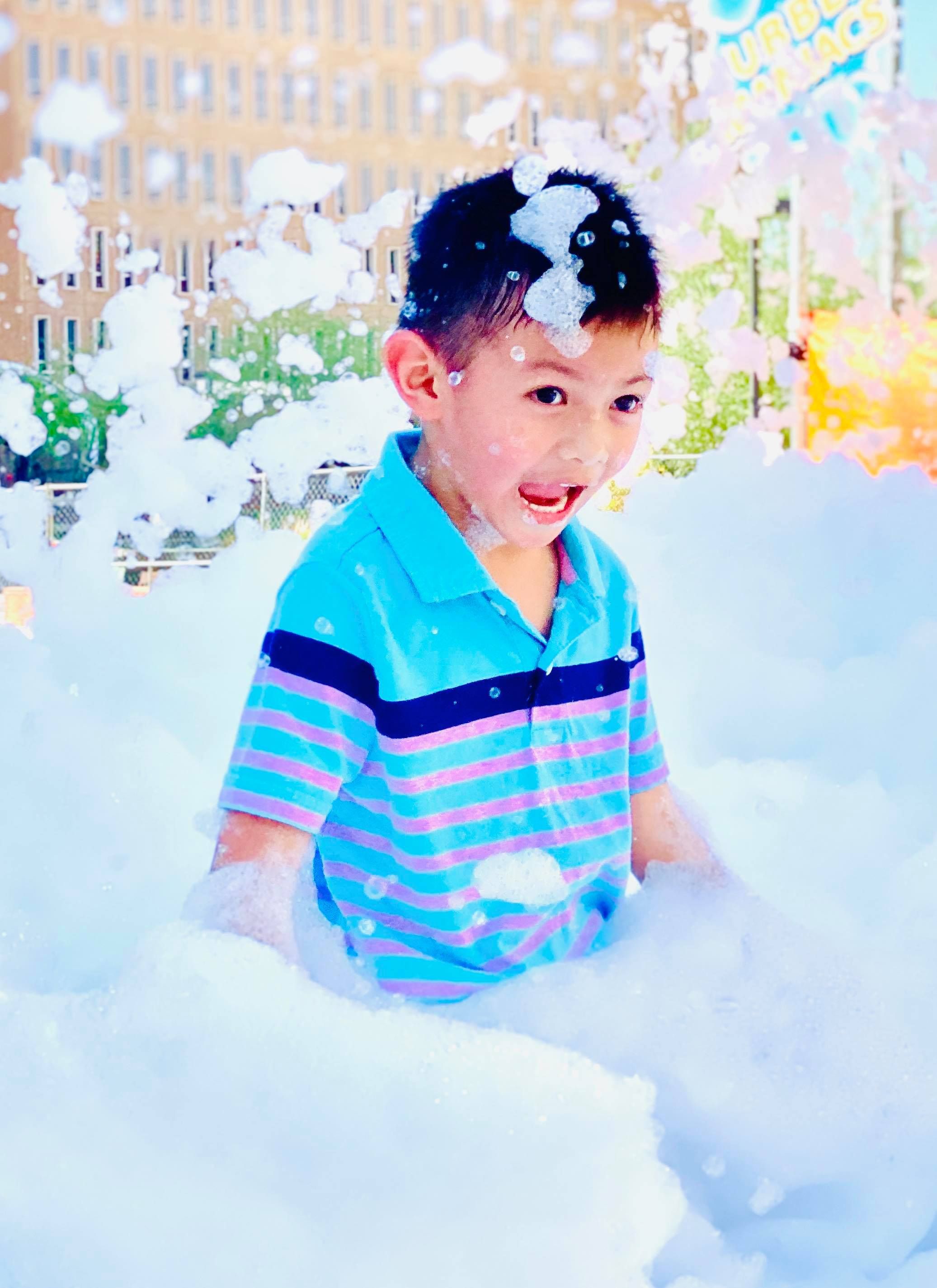Kid covered in foam