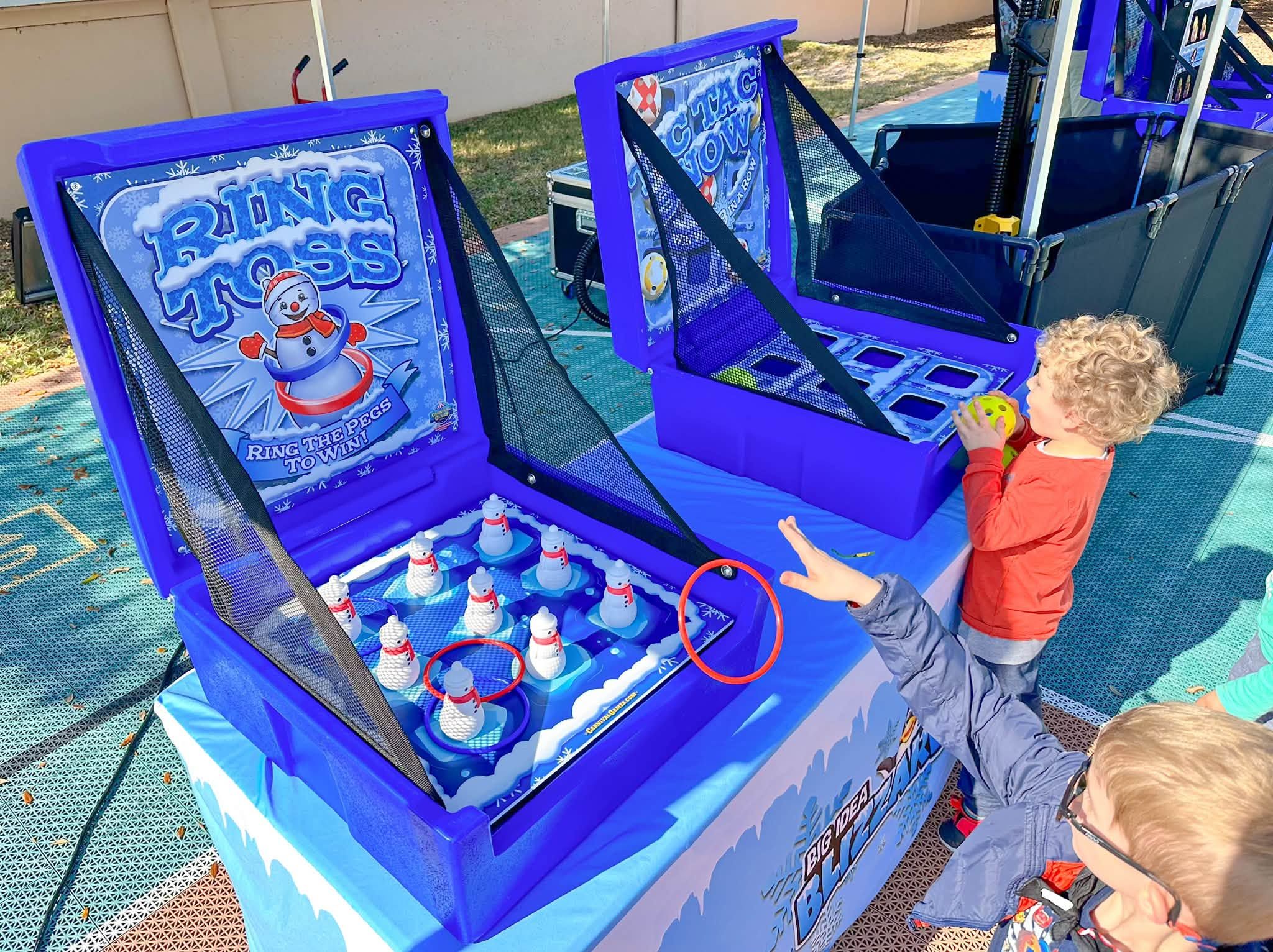 Kids play Ring Toss and Tic Tac Snow under a Blizzard tent