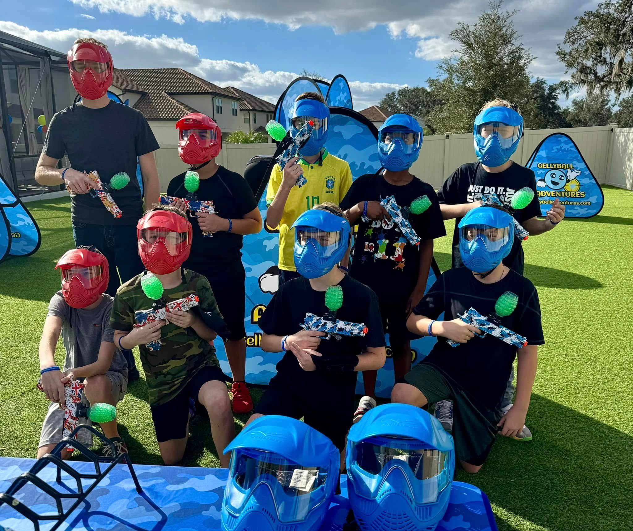 A group of kids in red and blue masks after a gellyball game