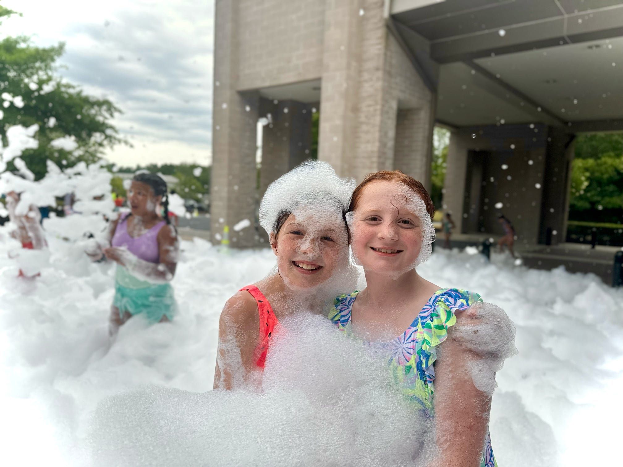 Kids playing in foam at a Foam Palooza party in Roswell, GA