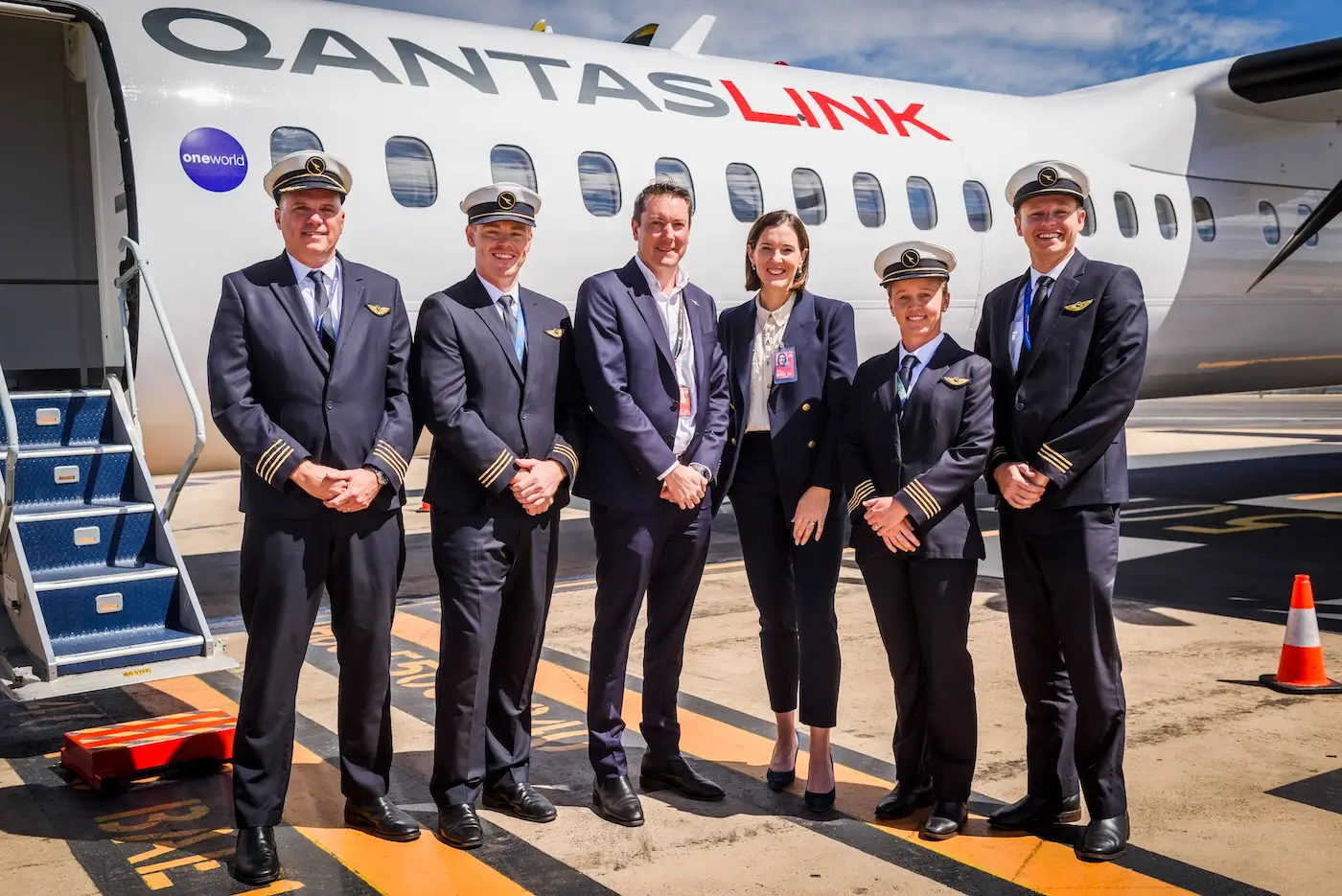 Qantas crew and QantasLink CEO Rachel Yangoyan with Dash 8