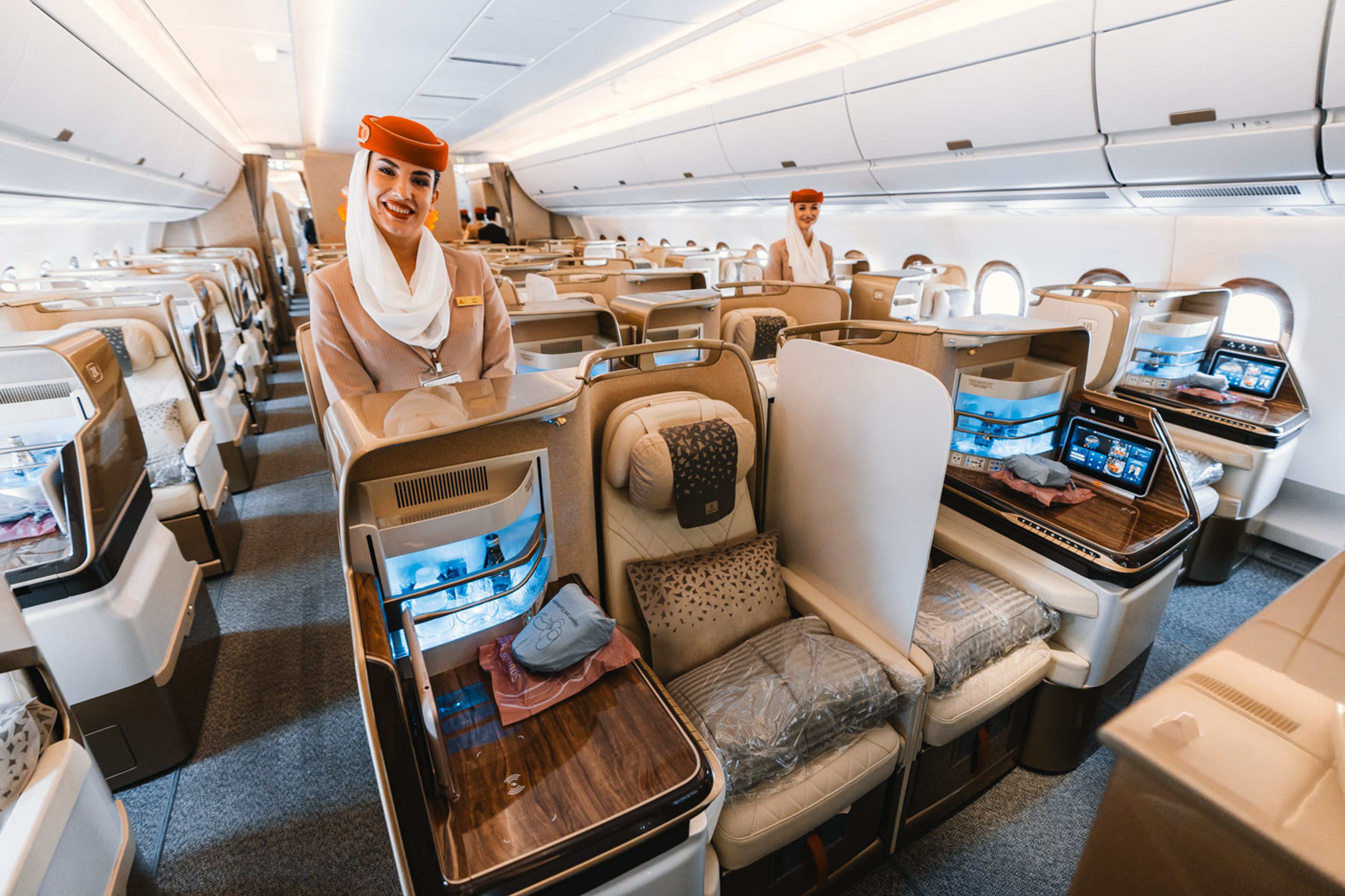 Emirates crew onboard the A350 business class cabin