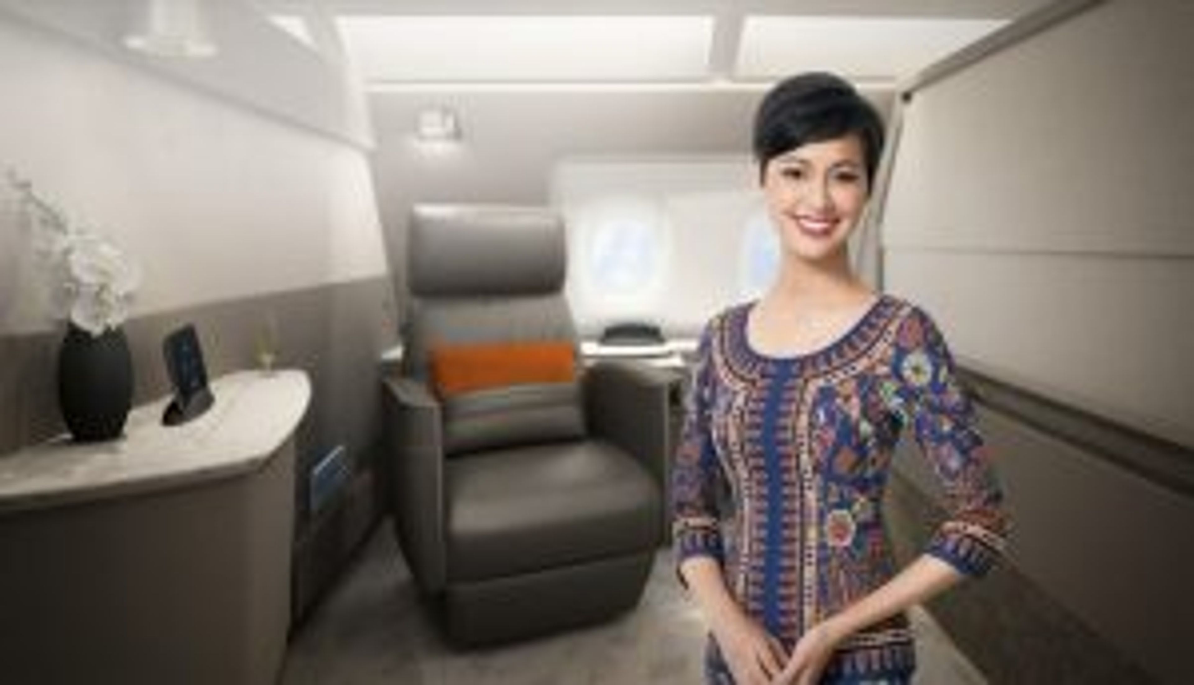 First Look New Singapore Airlines A380 First Class Suites flight attendant