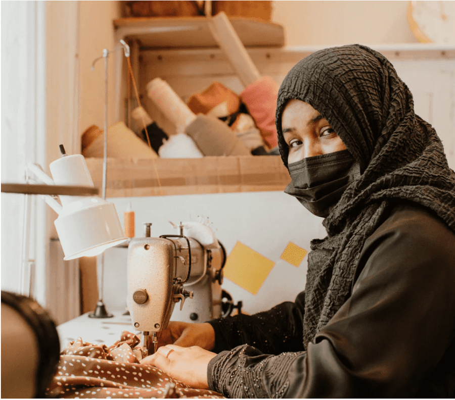 Woman sews Birdsong clothing