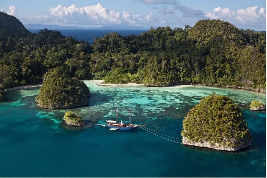 Islands of Bali - Forested islands surrounded by white beaches and turquoise waters.