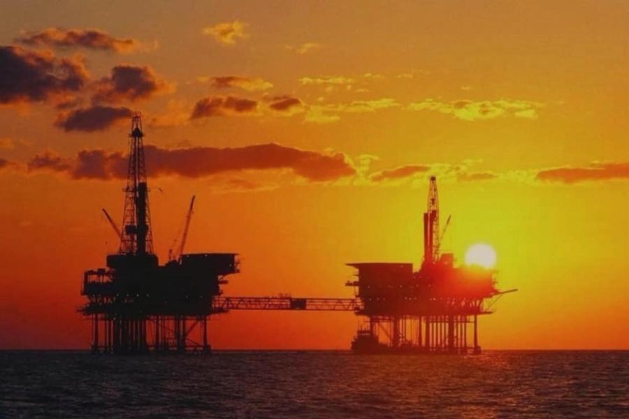 Offshore oil infrastructures at sunset