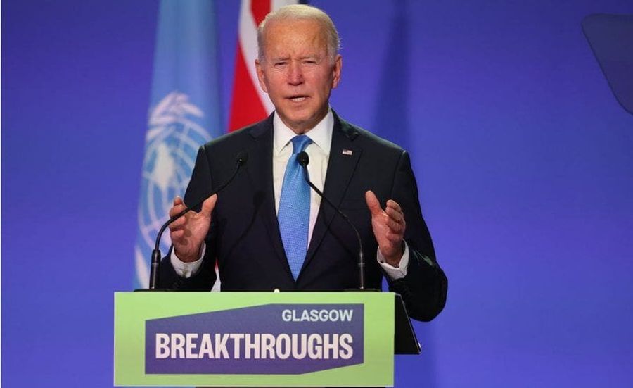 Joe Biden on the podium discussing the Breakthroughs at COP26