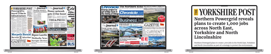 Three laptops with news coverage