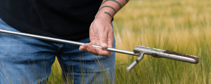 UNDO member collecting soil samples.