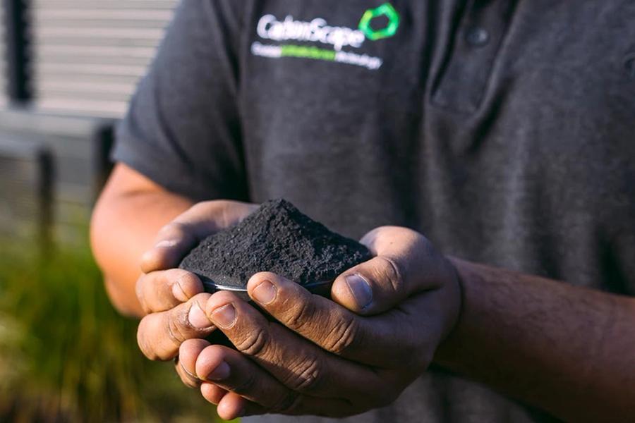Person holding CarbonScape renewable biographite