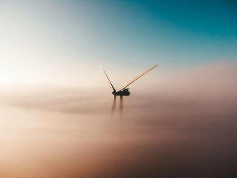 Early morning windmill sunrise in the mist