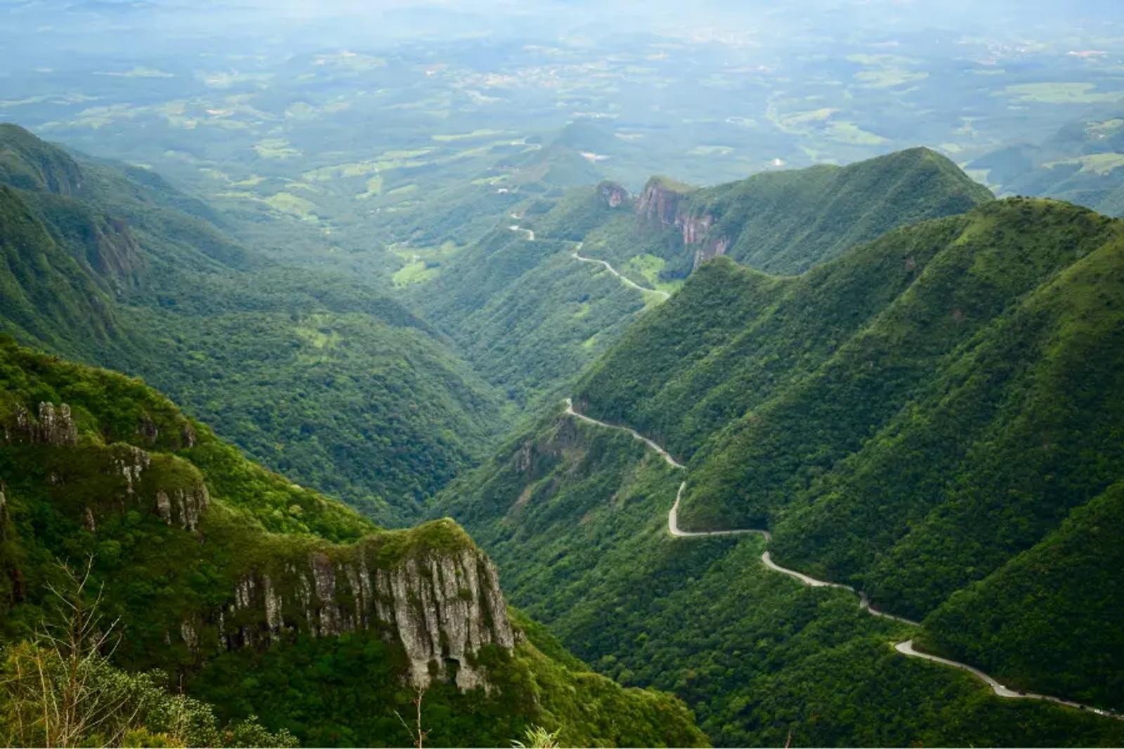 A winding road through lush green mountains