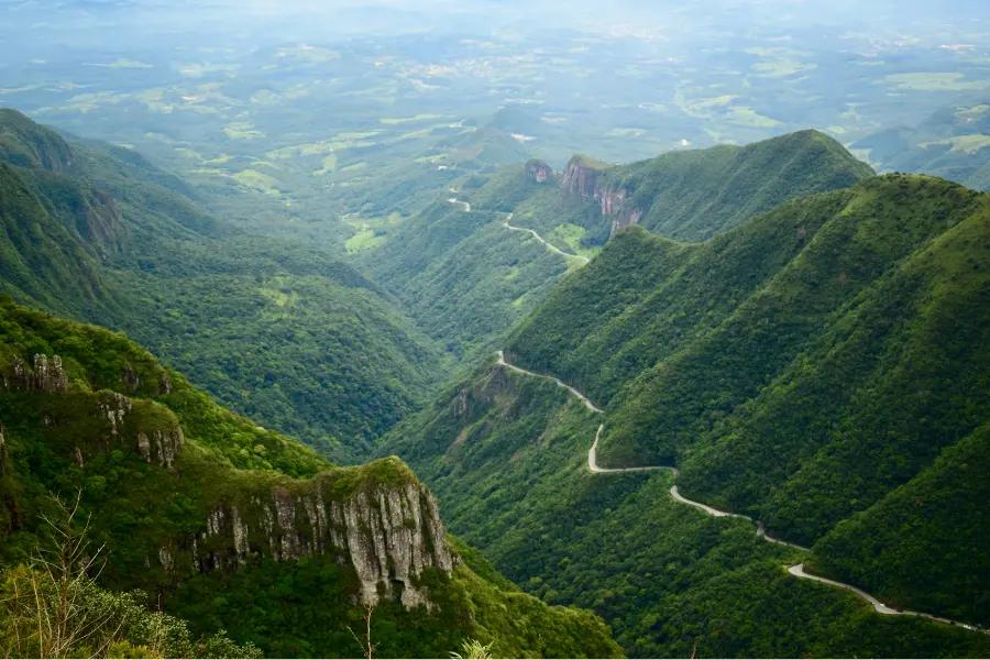 A winding road through lush green mountains