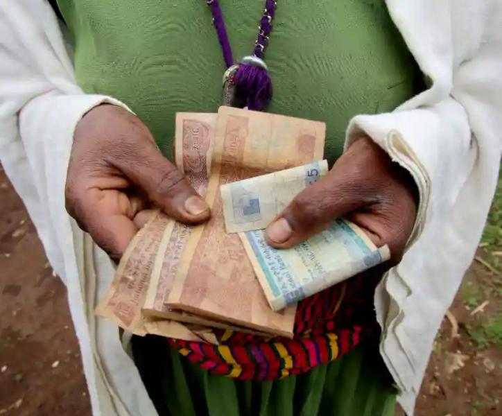 Person with money in their hands