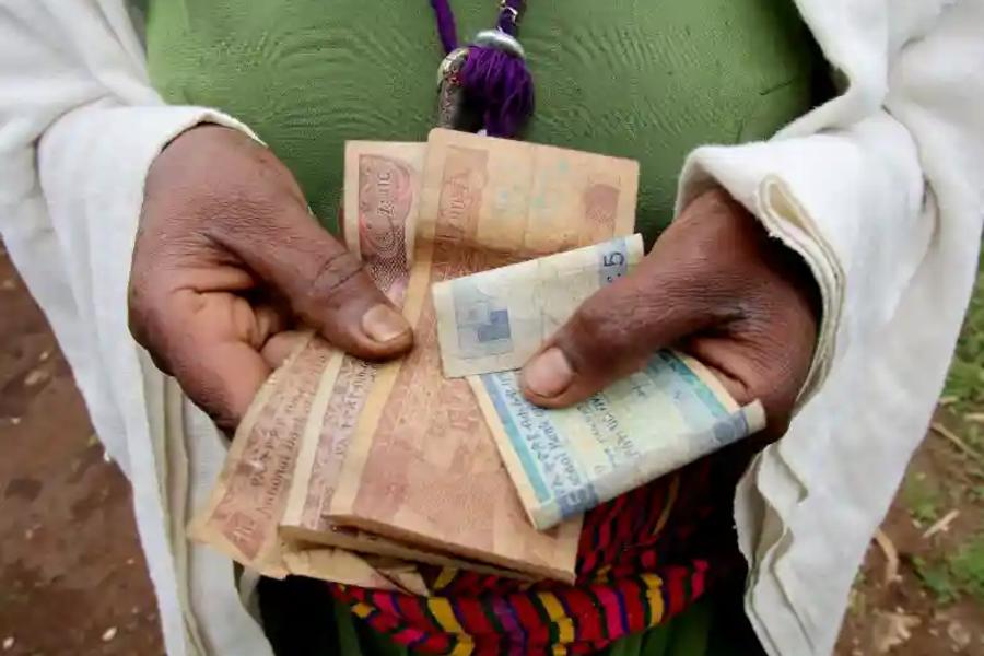 Person with money in their hands