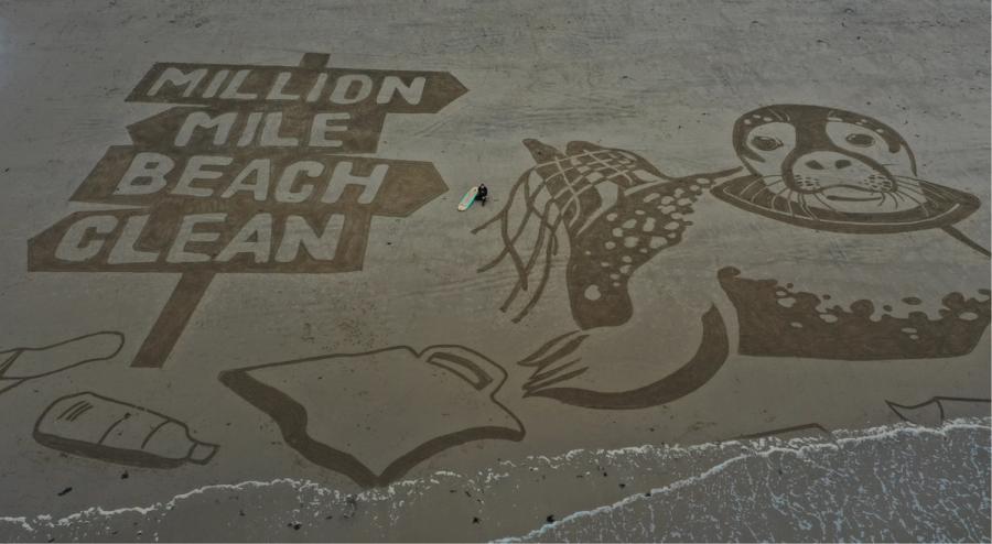 Beach artwork calling for clean beaches, showing marine wildlife and the words 'MILLION MILE BEACH CLEAN'.